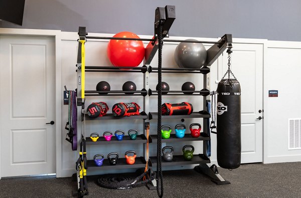Full-equipped fitness center at Advenir at Walker's Ridge Apartments with modern exercise machines and spacious workout areas