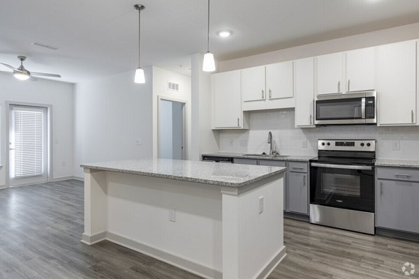 Modern kitchen featuring stainless steel appliances at Advenir at Walker's Ridge Apartments