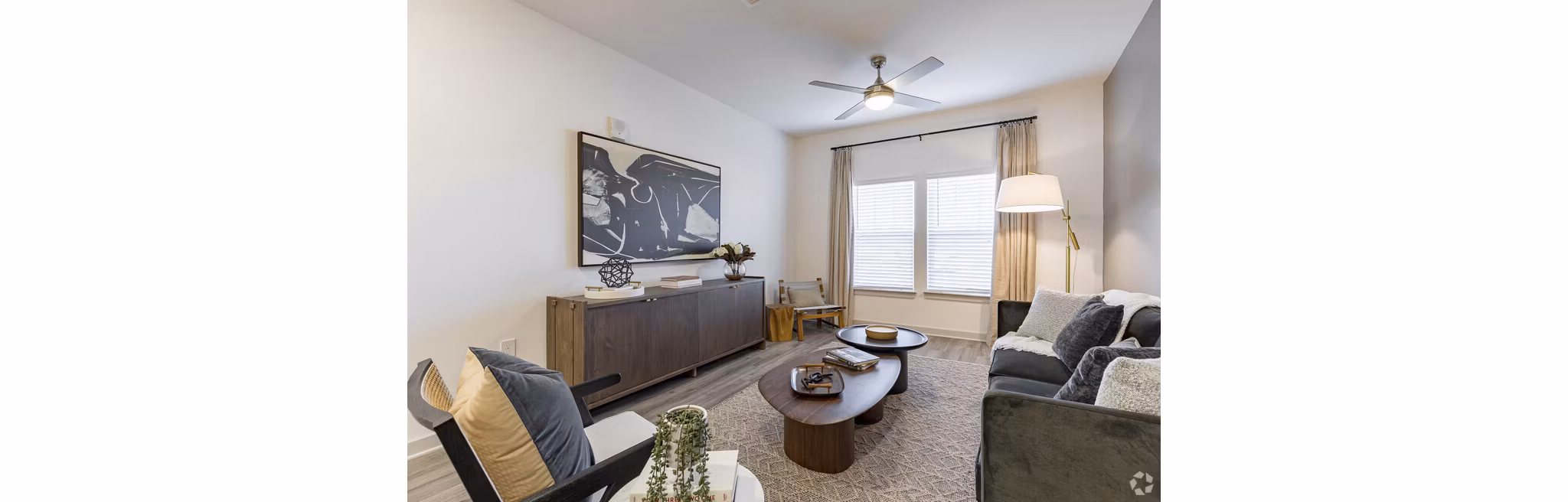 Spacious living room with modern decor and natural light in Advenir at Walker's Ridge Apartments, offering luxury living