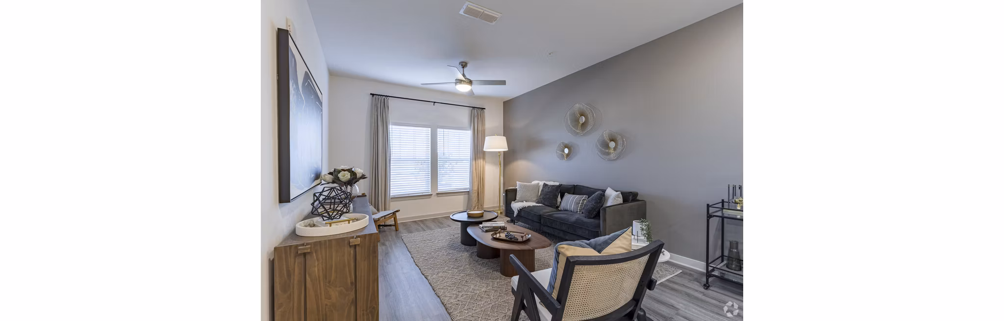 Spacious living room with modern decor in Advenir at Walker's Ridge Apartments