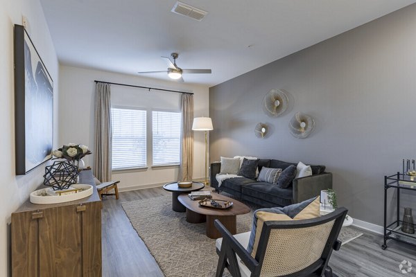 Spacious living room with modern decor in Advenir at Walker's Ridge Apartments