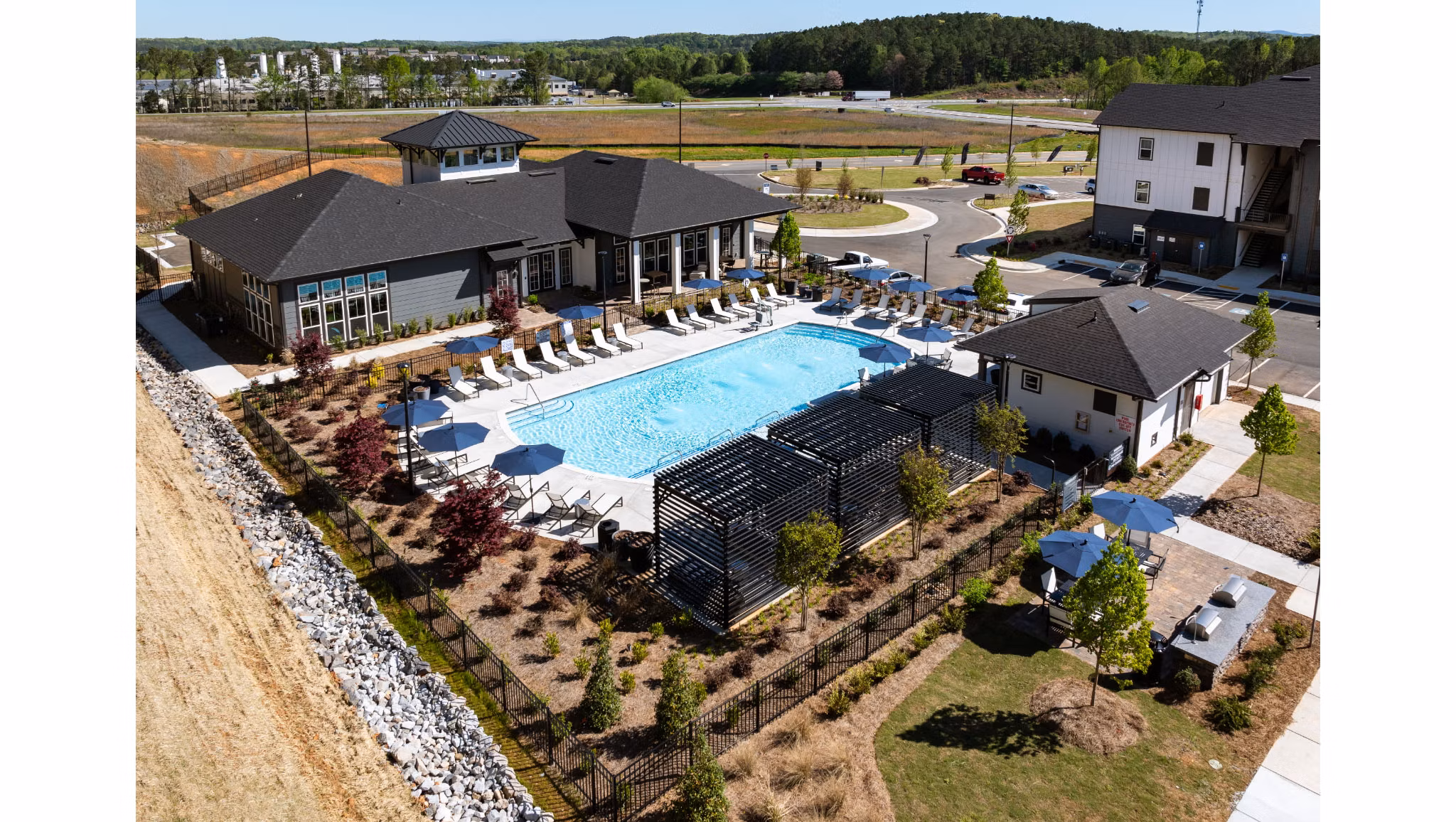 Advenir at Walker's Ridge: Scenic view of luxury apartments surrounded by lush greenery