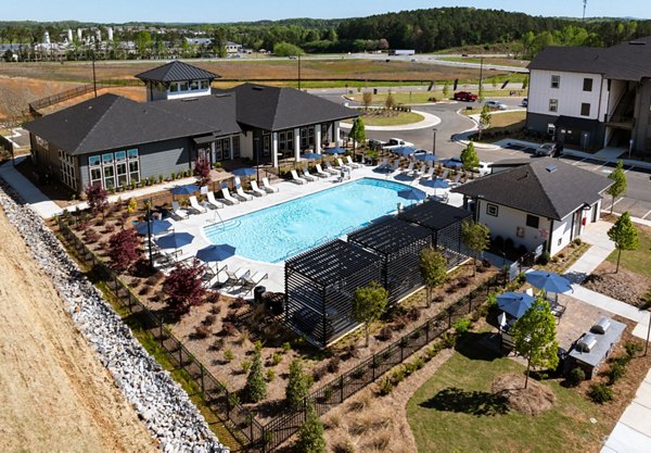 Advenir at Walker's Ridge: Scenic view of luxury apartments surrounded by lush greenery