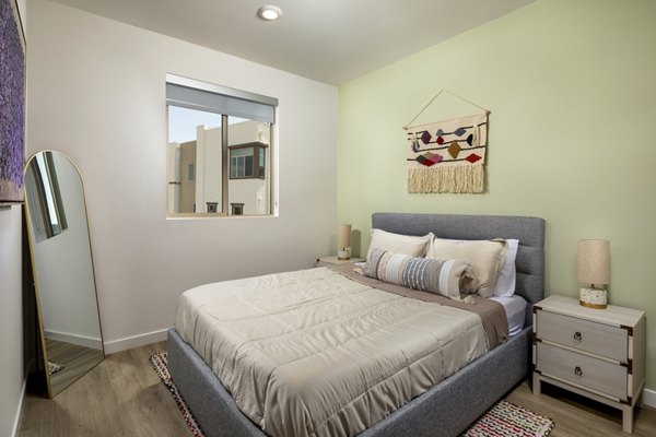 Suncrest at Ponte Vista: Luxurious bedroom with modern decor and natural light in Greystar's luxury apartments