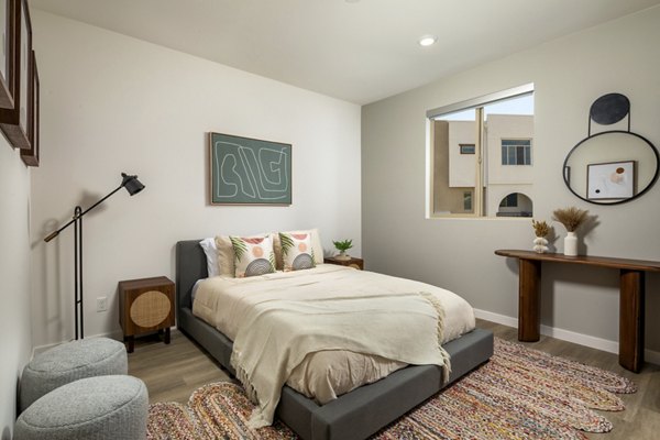 Cozy bedroom with modern decor at Suncrest at Ponte Vista Apartments, featuring luxury amenities and spacious design for comfortable living