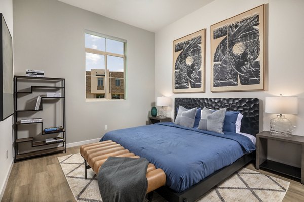 Modern bedroom with large window and chic decor at Suncrest at Ponte Vista Apartments