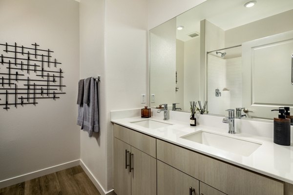 Modern bathroom with sleek fixtures at Suncrest at Ponte Vista Apartments, offering luxury living in a tranquil setting