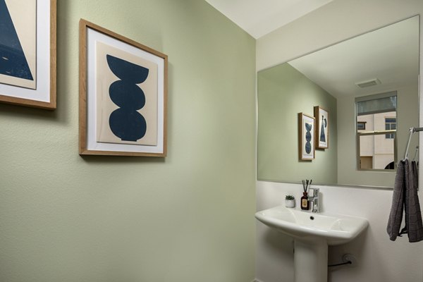 Bathroom with elegant fixtures and marble countertops in Suncrest at Ponte Vista Apartments