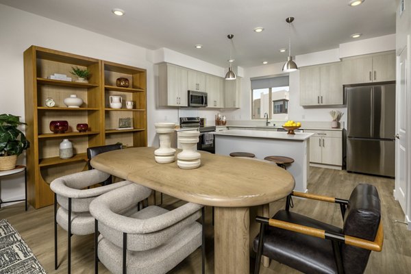 Dining area with modern furnishings and natural lighting at Suncrest at Ponte Vista Apartments