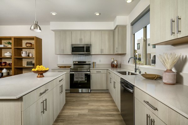 Contemporary kitchen with stainless steel appliances at Suncrest at Ponte Vista Apartments
