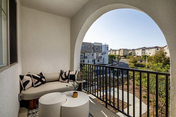 Suncrest at Ponte Vista Apartments: Spacious patio with outdoor seating and lush greenery, perfect for relaxation and gatherings in a serene setting