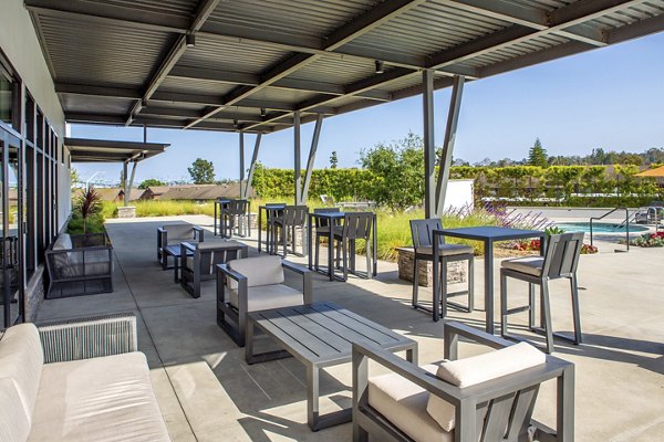 Cozy outdoor patio with lounge seating at Suncrest at Ponte Vista Apartments