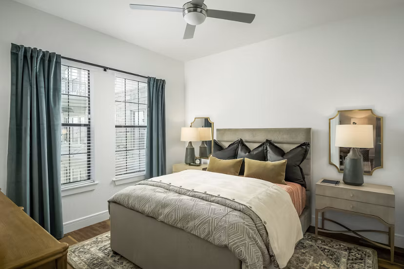 Spacious bedroom featuring modern decor and natural light at The Alyssa Apartmentsluxury apartments