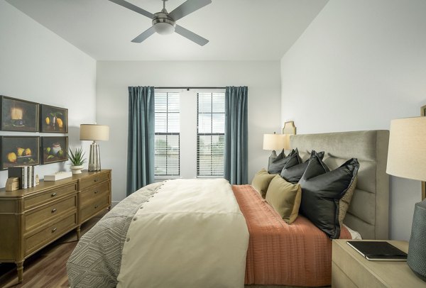 Cozy bedroom with stylish decor at The Alyssa Apartments