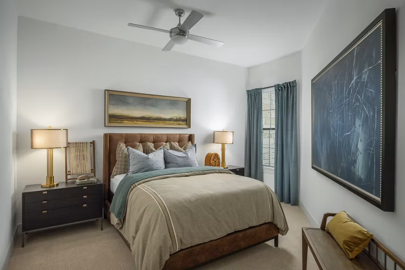 Bedroom featuring modern decor and plush bedding at The Alyssa Apartments