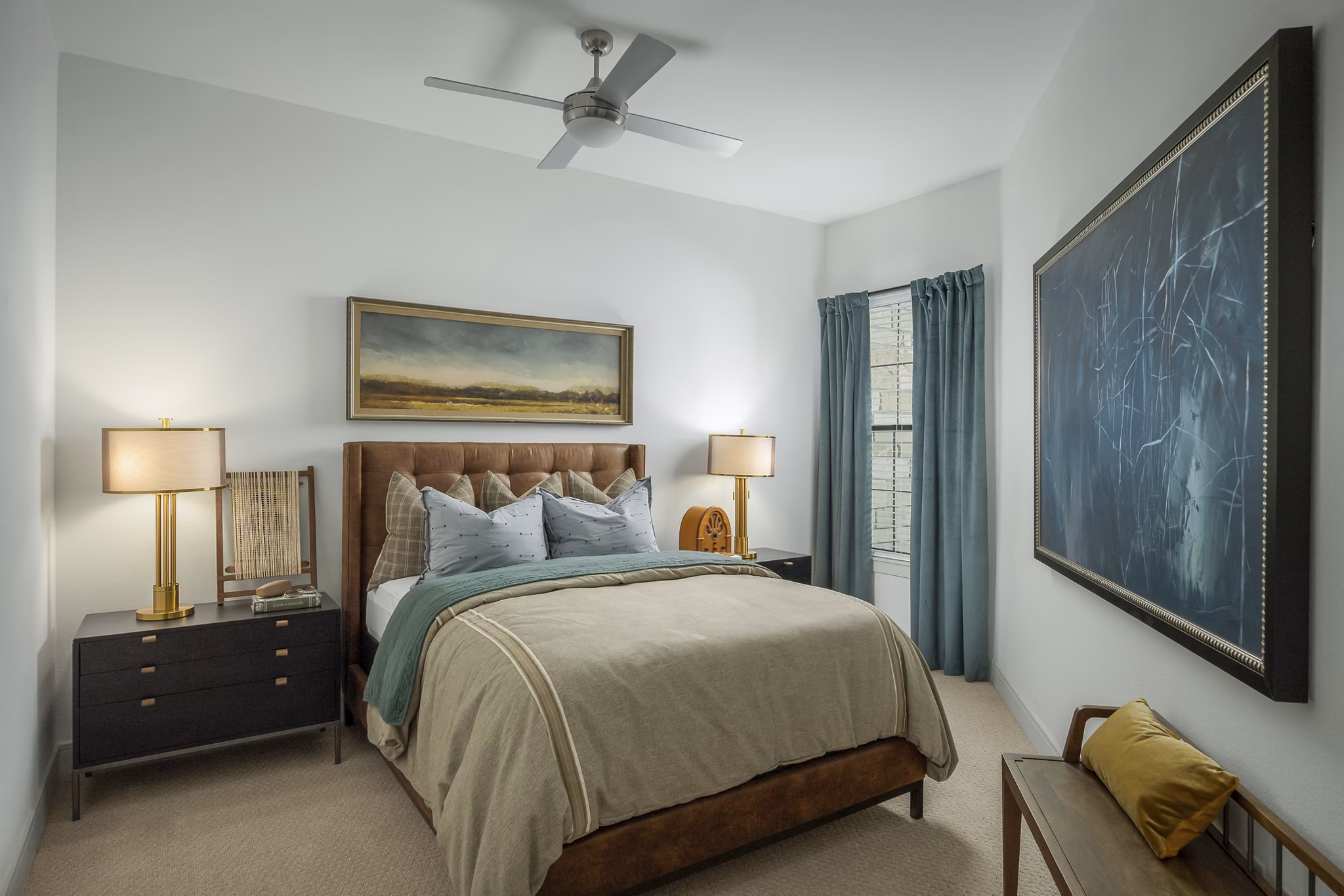 Bedroom featuring modern decor and plush bedding at The Alyssa Apartments