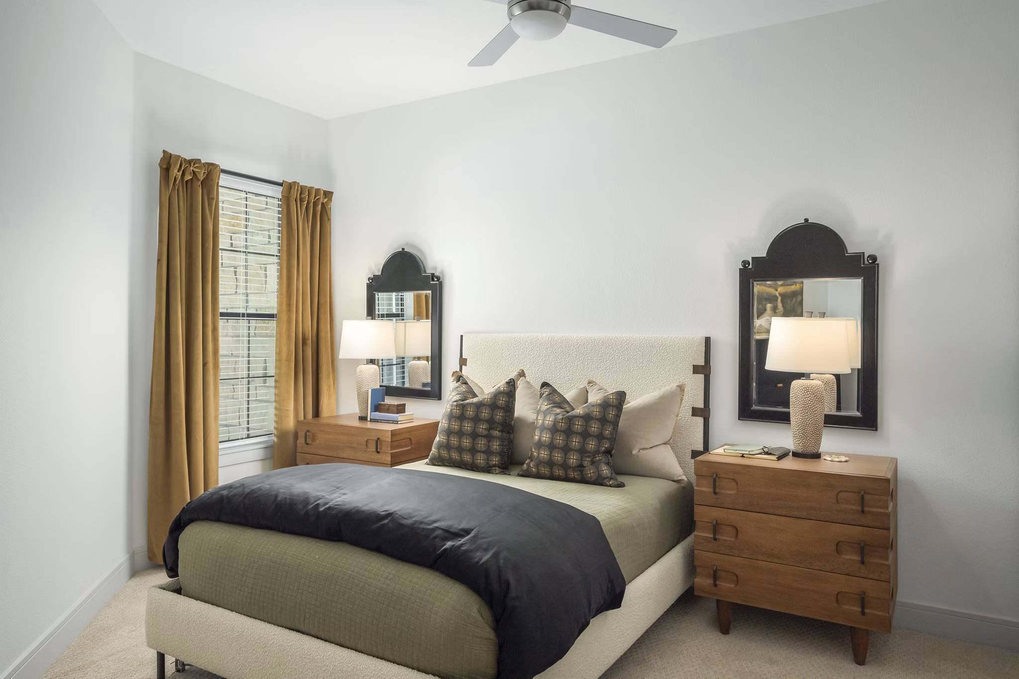 The Alyssa Apartments: Cozy bedroom with stylish decor and ample natural light in luxury Greystar property