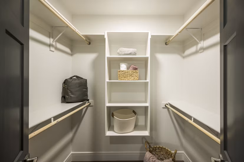 The Alyssa Apartments: Modern bedroom closet with ample storage solutions
