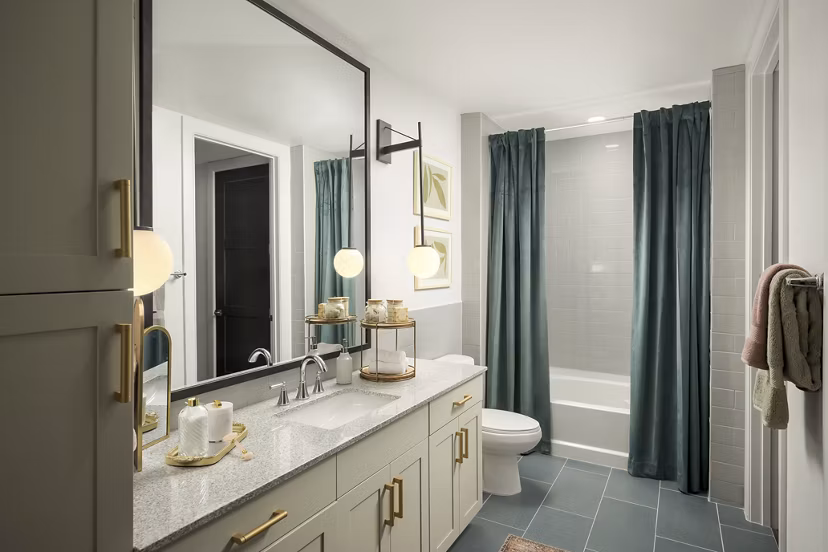Modern bathroom with sleek fixtures at The Alyssa Apartments: Luxury Greystar living with elegant design and functionality in every detail