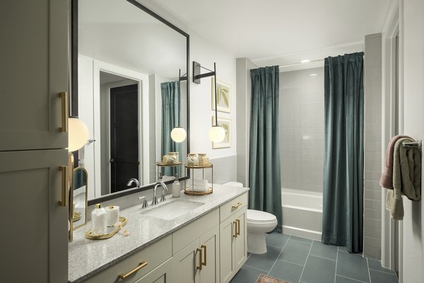 Modern bathroom with sleek fixtures at The Alyssa Apartments: Luxury Greystar living with elegant design and functionality in every detail