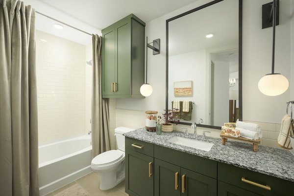 Modern bathroom with designer fixtures at The Alyssa Apartments