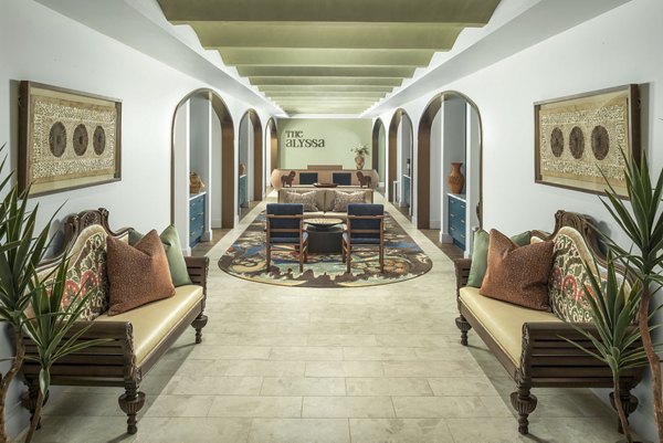 Clubhouse with contemporary design and comfortable seating at The Alyssa Apartments, offering premium social spaces for residents