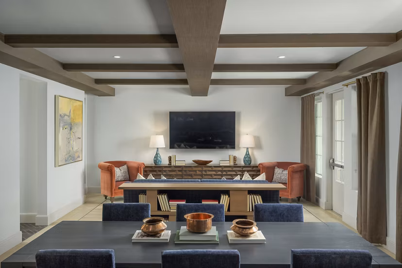 Clubhouse featuring modern design and seating areas at The Alyssa Apartments