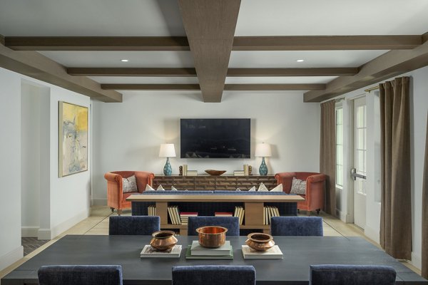 Clubhouse featuring modern design and seating areas at The Alyssa Apartments