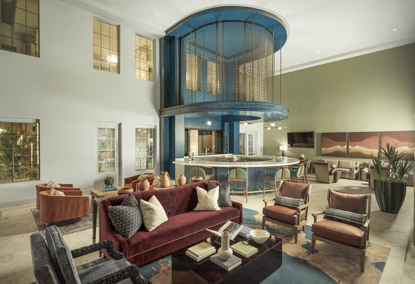 Clubhouse at The Alyssa Apartments: Modern communal space featuring stylish seating and large windows