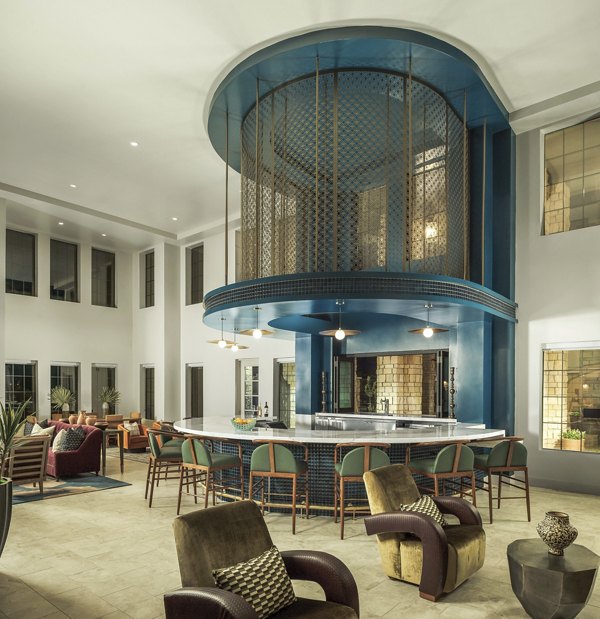 The Alyssa Apartments: Modern clubhouse featuring stylish seating and vibrant decor in a luxury setting