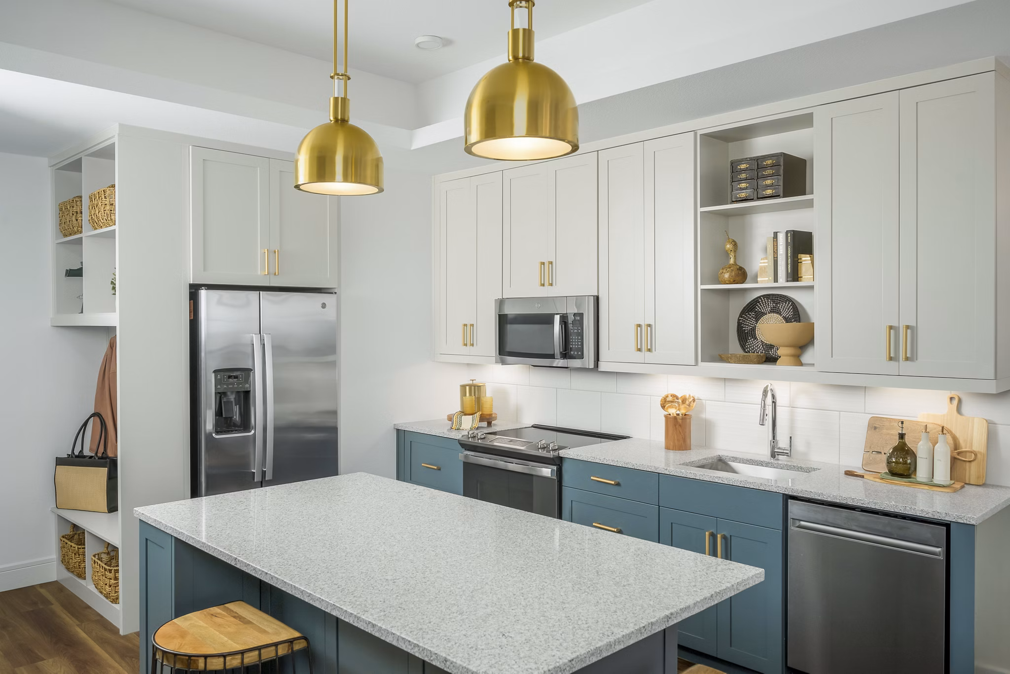 Elegant kitchen with modern appliances and marble countertops in The Alyssa Apartments