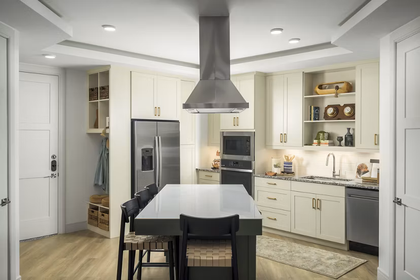 Modern kitchen with stainless steel appliances and granite countertops at The Alyssa Apartments