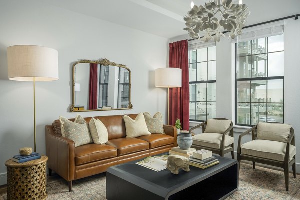 Spacious living room with modern furnishings in The Alyssa Apartments, Greystar's luxury property in downtown