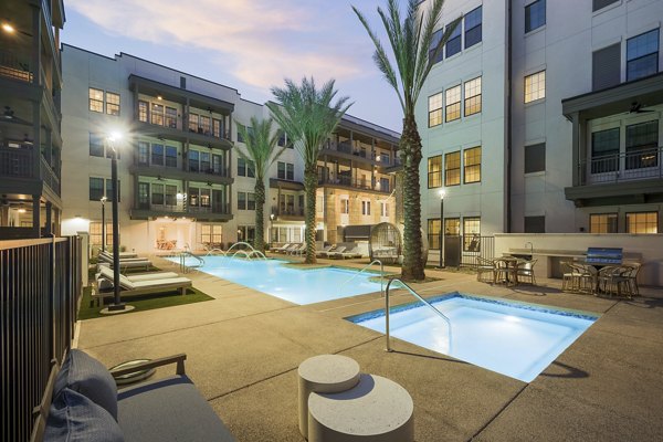 Relaxing hot tub at The Alyssa Apartments offering a luxurious amenity in a serene environment