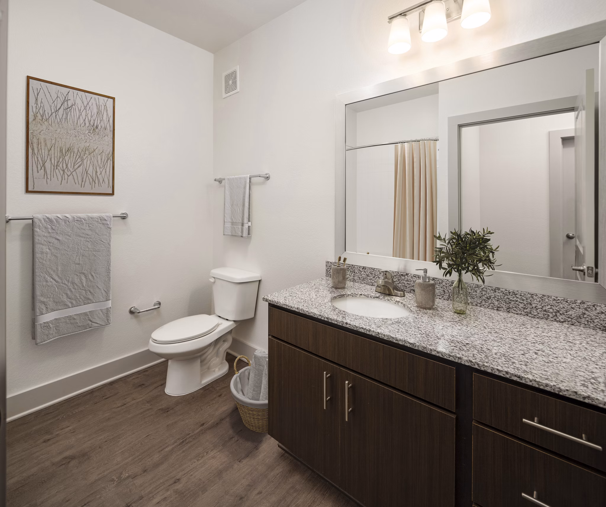 Sleek bathroom with modern fixtures and white marble countertop at Arden Apartments luxury residence