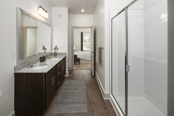 Elegant bathroom featuring modern vanity and sleek fixtures in Arden Apartments