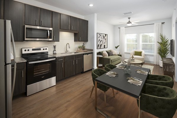 Contemporary kitchen with stainless steel appliances in Arden Apartments