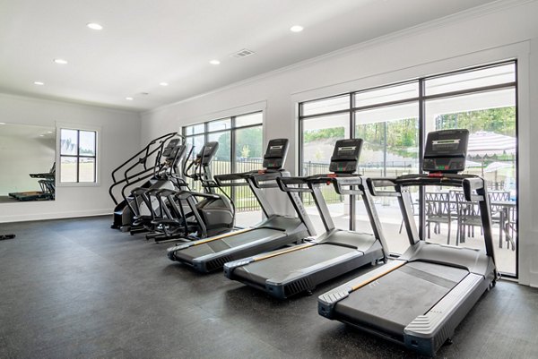 State-of-the-art fitness center at Summerwell Parkway Village Apartments offering modern equipment for a complete workout experience