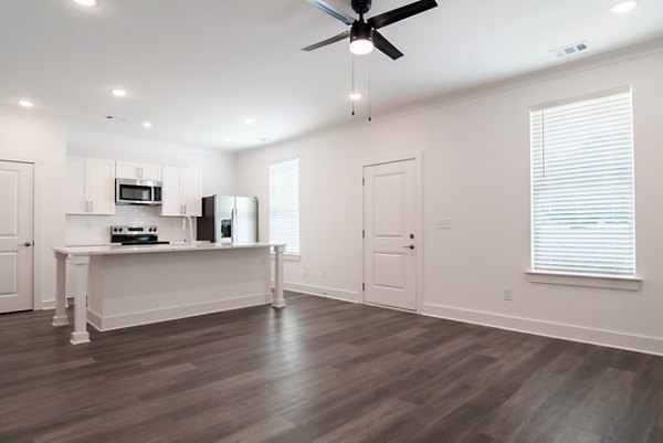 Cozy living room with modern furnishings at Summerwell Parkway Village Apartments