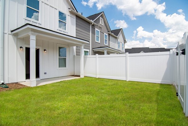 Recreational area featuring modern outdoor seating at Summerwell Parkway Village Apartments