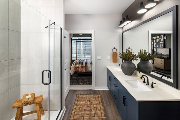 Sleek bathroom featuring modern fixtures at Milo Apartments