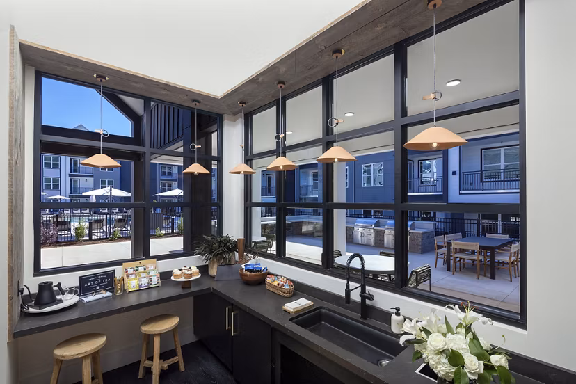 Luxurious clubhouse with contemporary furnishings at Milo Apartments, perfect for socializing and relaxation in a premier living environment