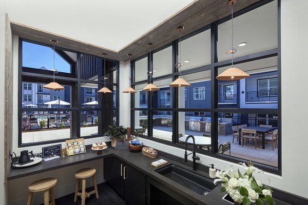 Luxurious clubhouse with contemporary furnishings at Milo Apartments, perfect for socializing and relaxation in a premier living environment