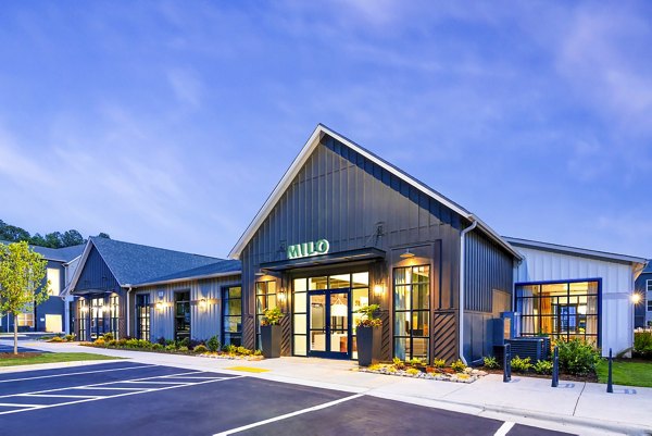 Stylish clubhouse with modern lounge and game area at Milo Apartments, offering luxury living