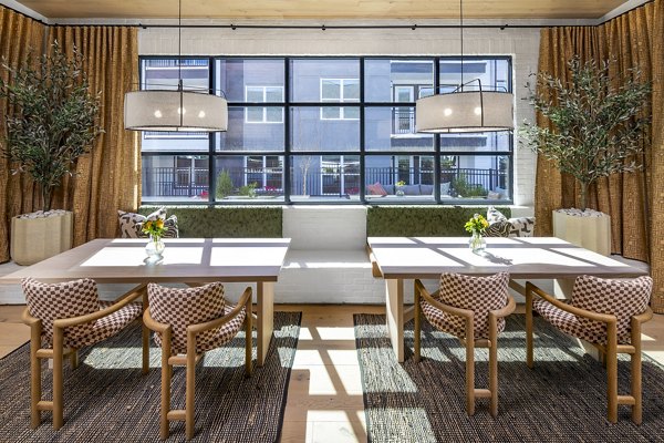 Elegant clubhouse with modern seating and decor at Milo Apartments, offering luxury living and social spaces