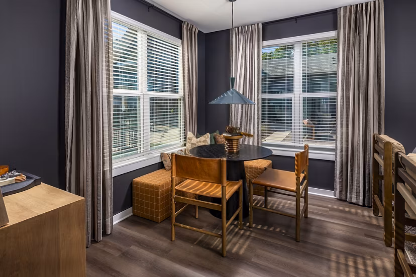 Dining room with modern decor and chic lighting at Milo Apartments, luxury living by Greystar