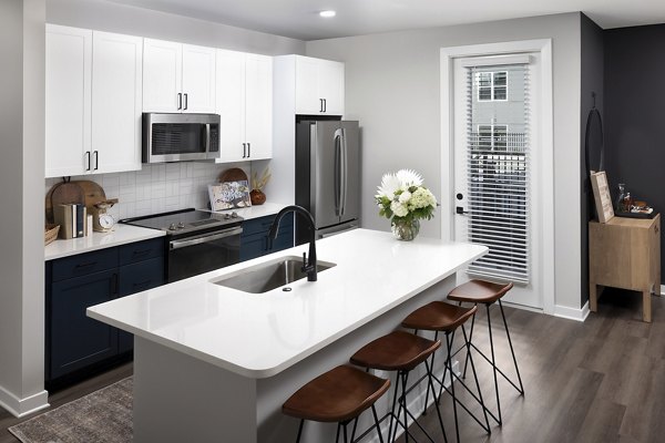 Modern kitchen with stainless steel appliances at Milo Apartments