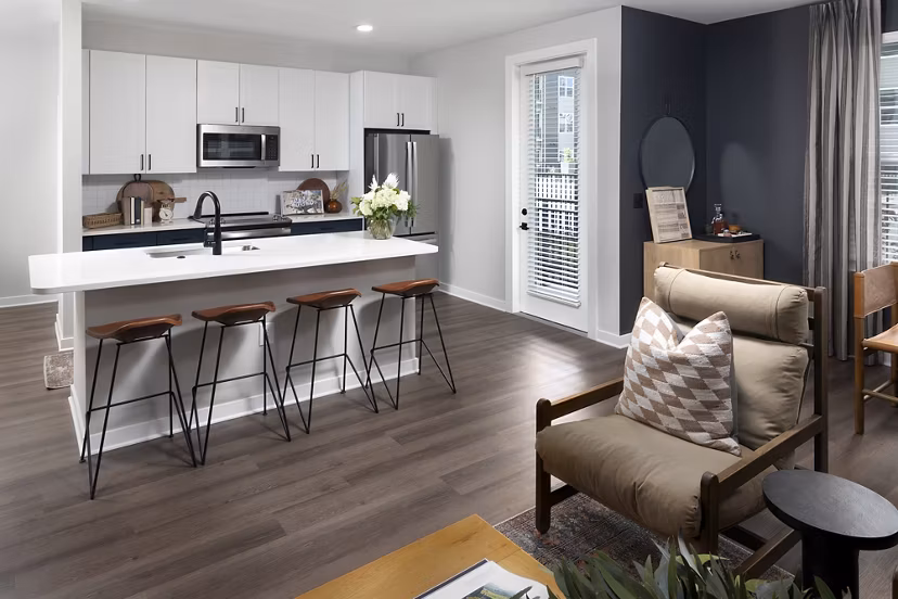 Milo Apartments: Sleek kitchen featuring modern appliances and quartz countertops