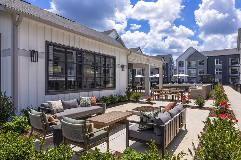 Expansive patio with modern seating at Milo Apartments, ideal for relaxation and social gatherings