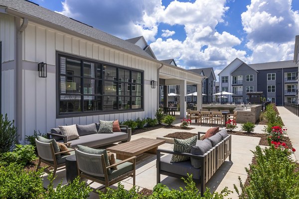 Expansive patio with modern seating at Milo Apartments, ideal for relaxation and social gatherings